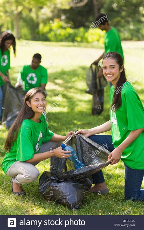 Volunteers Picking Up Litter In Park Stock Photo Alamy