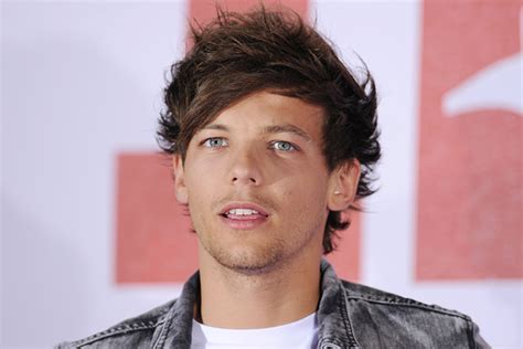 Louis Tomlinson Falls Onstage While Performing 'Kiss You' [Video]
