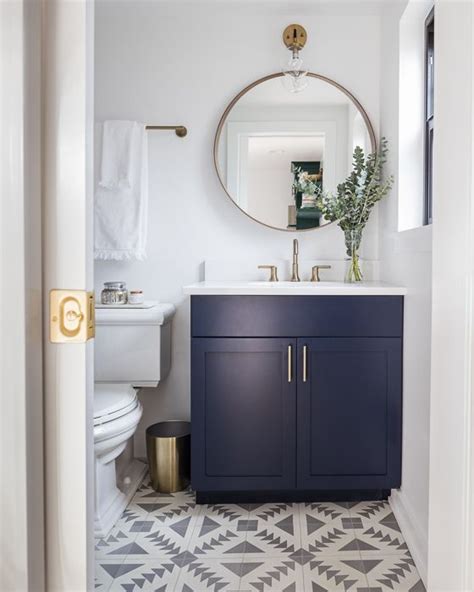 Which products in blue bathroom vanities are exclusive to the home depot? Modern bathroom with navy blue vanity, gold accents, and ...
