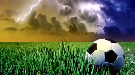 Football On Green Grass In Lightning Sky Background Hd Football
