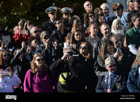 Spectators Watch And Take Pictures During A Ceremony At The Tomb Of The