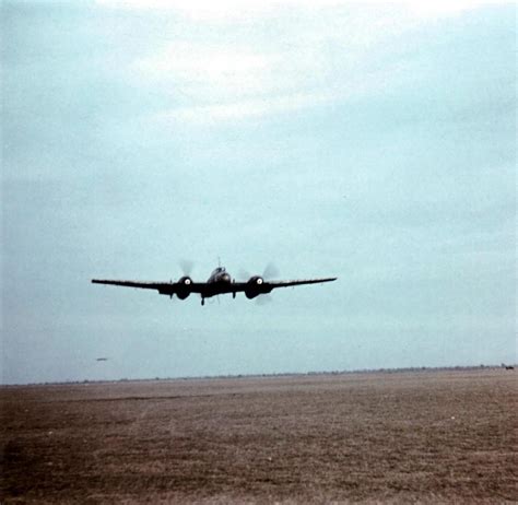 A Messerschmidt Bf 110 Flys Low Over A German Airfield On The Eastern Front Wwiipics