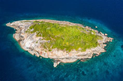 Aerial Drone View Of A Tiny Beautiful Tropical Island Surrounded By