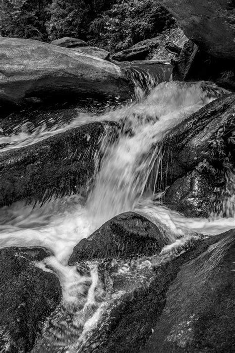River Stream Flowing Over Rock Formations In The Mountains Photograph