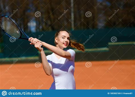 Girl Tennis Player Holding Tennis Racket On The Court Young Woman Is