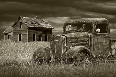 Vintage Pickup In Sepia Tone By An Abandoned Farm House Photograph By