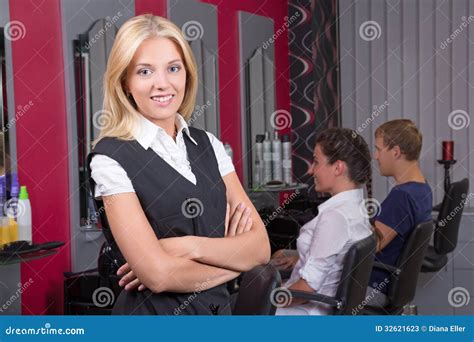 Portrait Of Professional Hairdresser Posing In Beauty Salon Stock Image