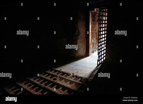 Light Shining Through The Doorway In A Solitary Confinement Cell In