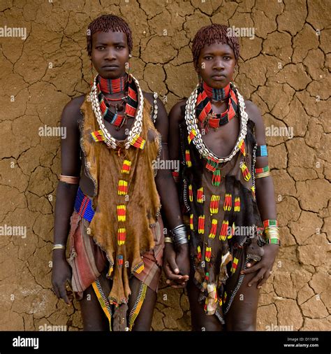 Portrait Of Two Hamar Tribe Women Posing With Traditional Necklace And