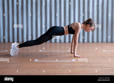 Fit Woman Doing Push Ups Or Full Plank Exercise Works On Abdominal
