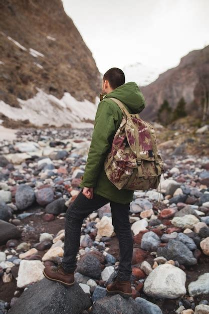 Free Photo Young Hipster Man Hiking By The River Wild Nature