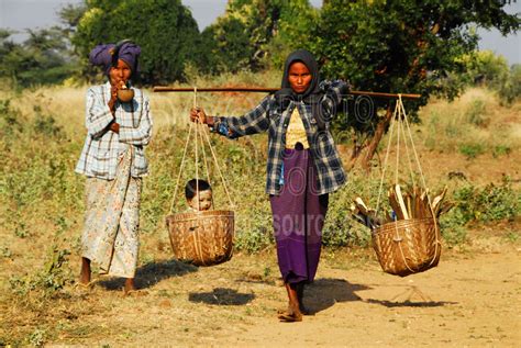 Photo of Woman Carrying Baskets by Photo Stock Source people, Bagan ...