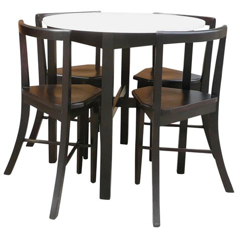 Our collection of white dining tables and black dining tables make for an artful arrangement. Small Round Contoured Dining Set at 1stdibs