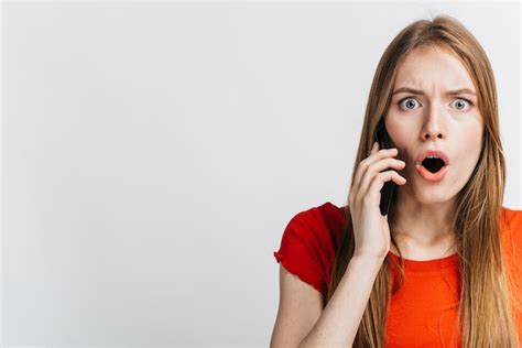 Free Photo Shocked Woman Talking On Her Phone With Copy Space