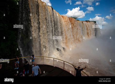 Tourists Admiring The Iguazu Falls One Of The Biggest Falls In The