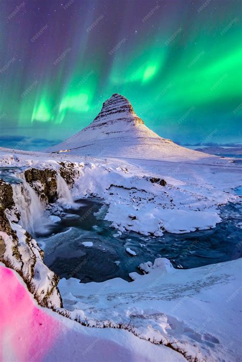 Premium Photo Northern Lights Appear Over Mount Kirkjufell In Iceland