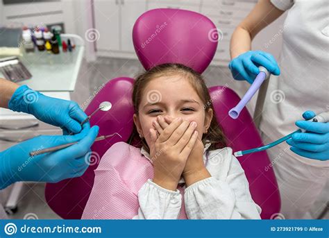 Little Scared Girl Covering Her Mouth With Her Hands While Visiting The