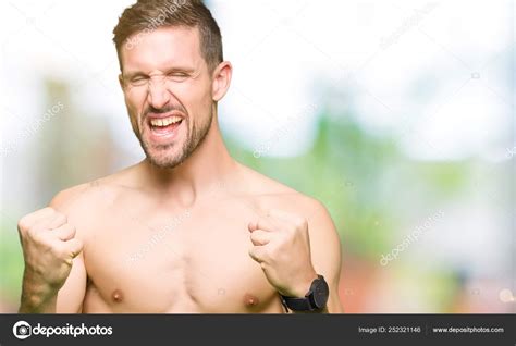 Handsome Shirtless Man Showing Nude Chest Very Happy Excited Doing Stock Photo By Krakenimages