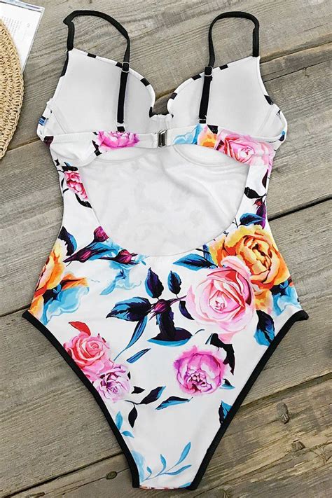 The Bold Floral And Stripe One Piece Swimsuit Has A Bustier Style