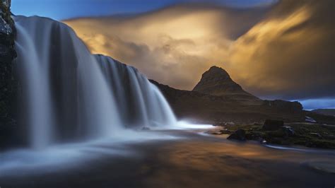 Amazing Clouds Over Waterfall