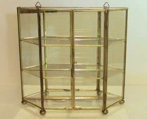 The cabinet has glass shelving to display all your trinkets and an elegant contemporary design that helps to intensify the look of anything displayed inside the curio. Small Glass Curio Cabinet Display Case - Foter