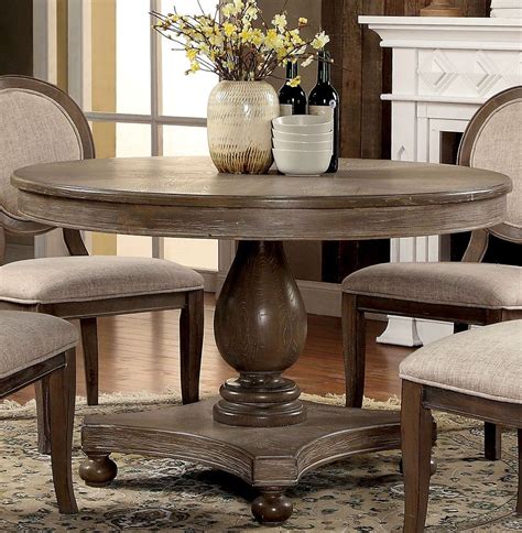This table is sized to seat four and would fit. Siobhan Rustic Dark Oak Round Dining Table - 1StopBedrooms.