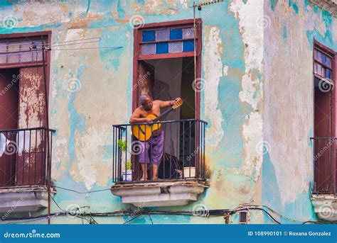 Urban Scene With Musician In The Balcony Of Old Havana Building Cuba