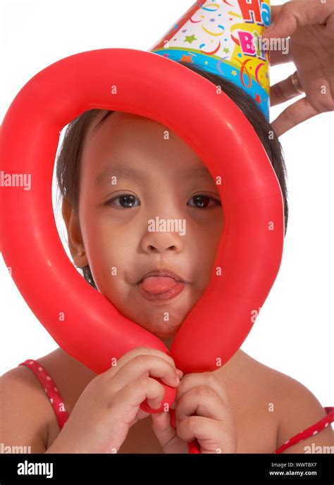 Kid Making Funny Faces At A Birthday Party Stock Photo Alamy