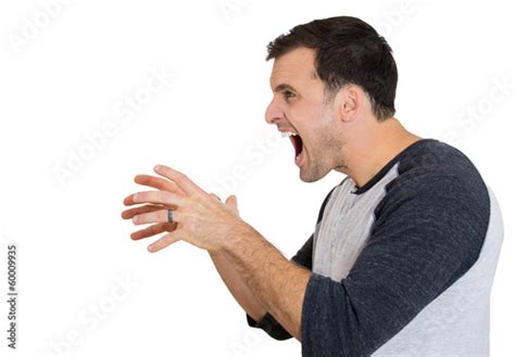 Side View Of A Angry Frustrated Man Yelling At Someone Stock Photo