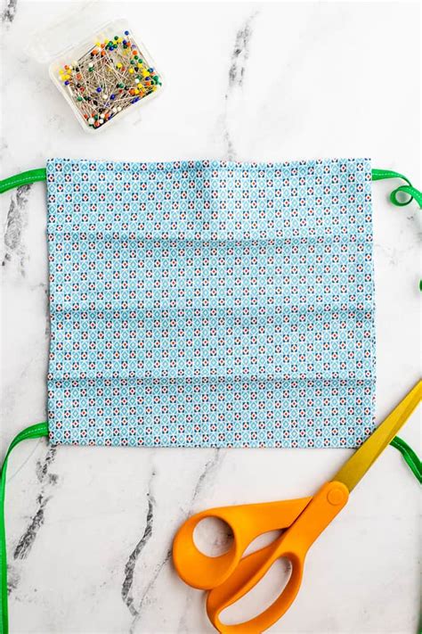 Free face mask sewing pattern + step by step photo tutorial how to make a mask out of cloth (with pocket for filter insert). Pleated Face Mask Pattern with Ties or Elastic - Free ...