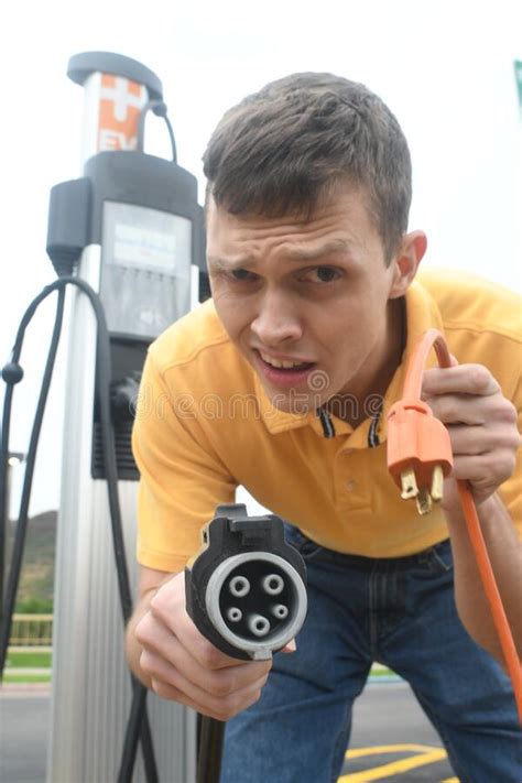 Man Charging His Electric Vehicle Stock Image Image Of Capacity