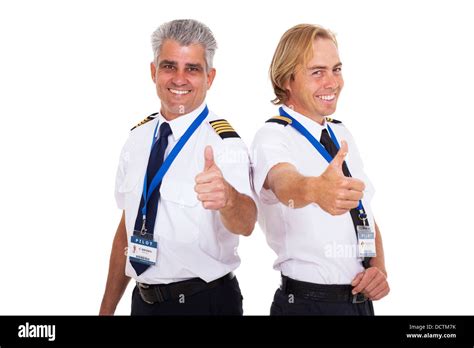 Happy Airline Pilots Giving Thumbs Up Isolated On White Stock Photo Alamy