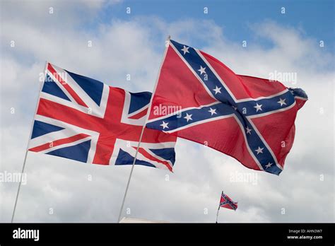 British Union Flag And American Confederate Flag Flying Together Stock