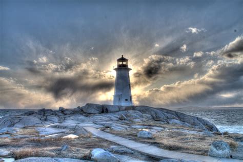 Peggy's Cove lighthouse at sunset on a stormy day in April. : pics