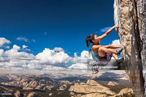 Rock Climber Clinging To A Cliff High Res Stock Photo Getty Images