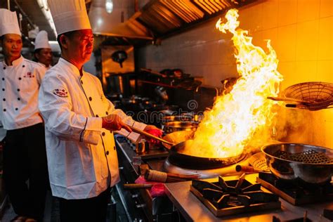 chef cooking chinese food with burning fire on steel pan editorial photography image of oven