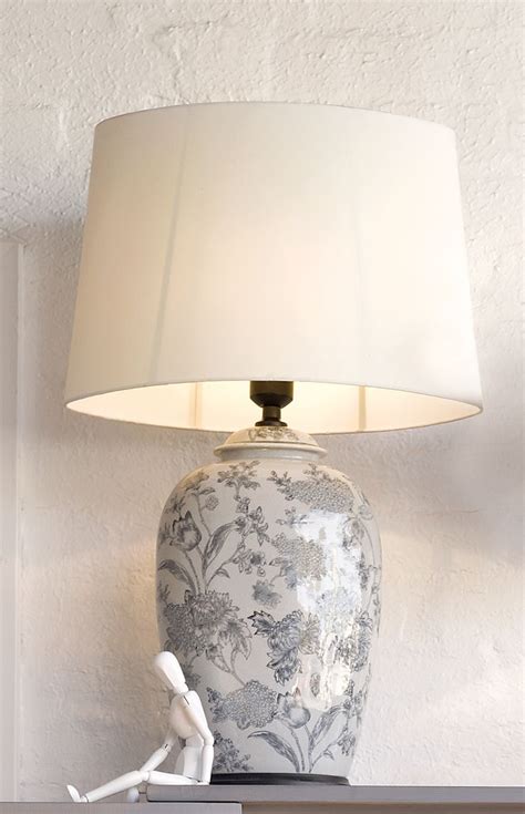 For over two years, my son's dresser doubled as his changing table. Inez 1 light large table lamp in white with black floral ...