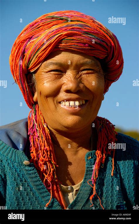 Portrait Older Burmese Woman In Traditional Dress Of Pa Laung Smiles