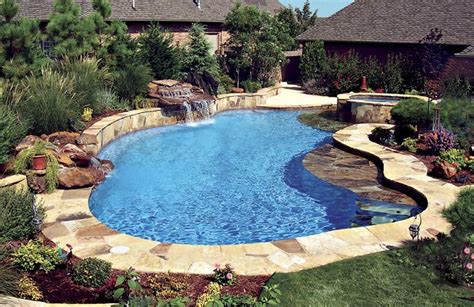 Free Form Swimming Pool With Tanning Ledge And Rock Waterfall