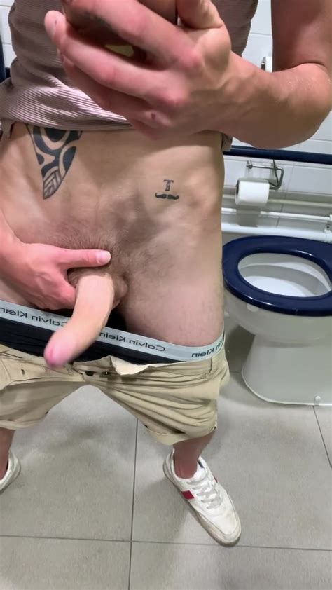 Showing Off His Big Uncut Cock In The Public Restroom