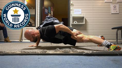 One Arm Push Ups With A 100 Lb Pack Guinness World Records Youtube