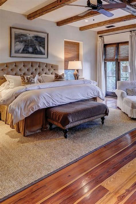 That said, decorating with area rugs on hardwood floors is not always simple. Awesome master bedroom with chair, hardwood floor and ...