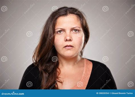 Portrait Of A Normal Woman Over Grey Background Stock Images Image