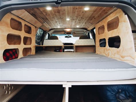 We converted our chevy suburban into a camper to live out of on our road trip. Camping Setup in a Chevy Suburban ... | Camper conversion ...