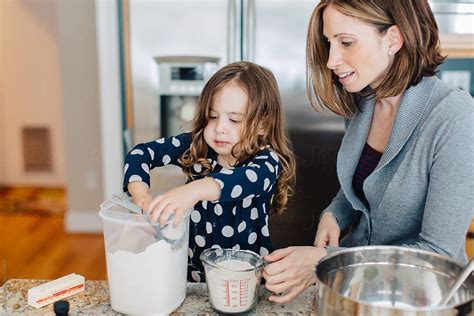 Mother Showing Daughter How To Make Chocolate Chip Cookies By Stocksy Contributor Jakob