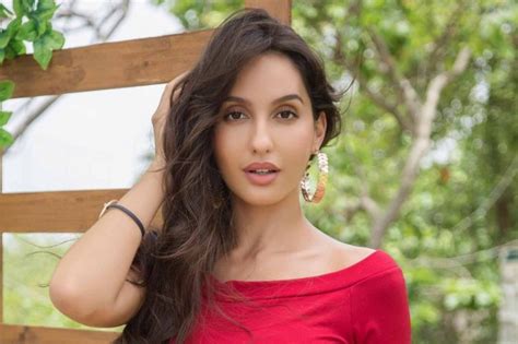 She keeps her styling simple and chic with a touch of luxurious oomph. pics of Nora Fatehi | New Wallpapers
