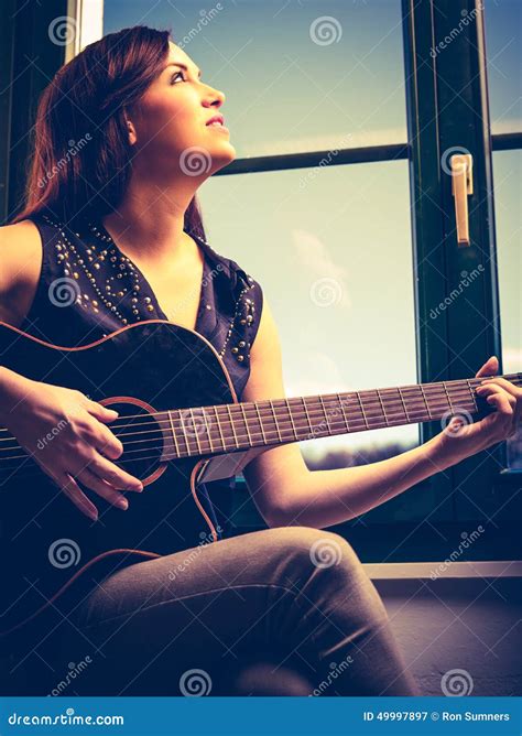 Beautiful Woman Playing Guitar By The Window Stock Image Image Of