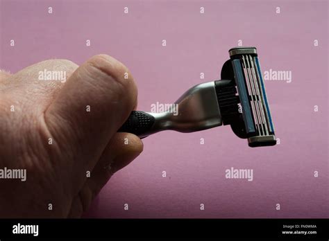 A Gillette Mach 3 Razor Blade The Razor Is In The Hands Of A Man Stock