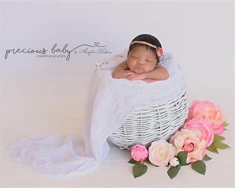 Gorgeous Newborn African American Baby Girl Sleeping In A White Basket