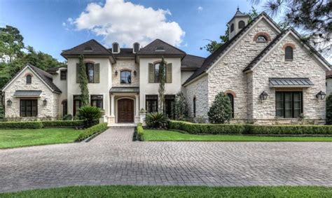 This French Country Style Stone And Stucco Home Is Located